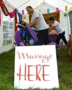 The On the Spot team massaging back stage at Glastonbury 2013